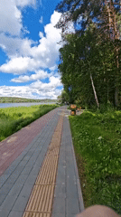 Lakeside park and outdoor event setup near Minsk