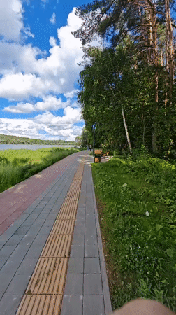 Lakeside park and outdoor event setup near Minsk