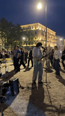 Band performs outdoors near bascule bridge in Saint Petersburg