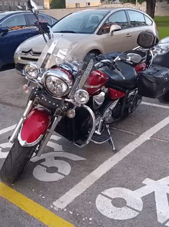 Red and black cruiser motorcycle parked in Tallinn