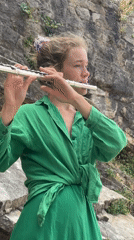 Street musician performs flute concert across scenic Budva locations