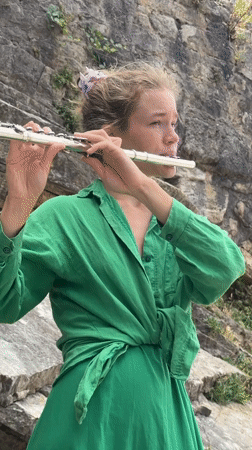 Street musician performs flute concert across scenic Budva locations