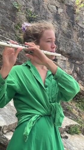 Street musician performs flute concert across scenic Budva locations