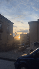 Video captures Italian residential street with parked cars