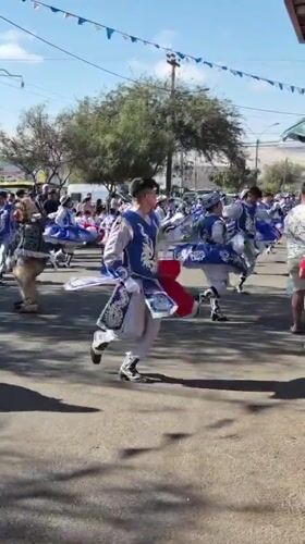Colorful street parade winds through Arica with dancers and floats