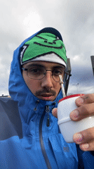 Man drinks from cup outdoors in Ushuaia, Argentina