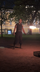 Fire performer gives nighttime torch show in park