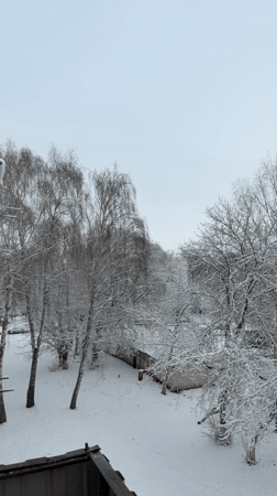 Woman takes selfies in snowy Naberezhnye Chelny with cat