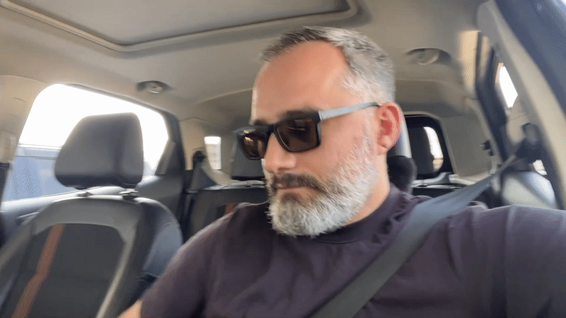 Leaving a Tbilisi parking garage in a Ford, midday