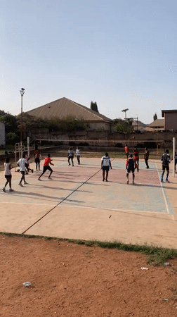 Youth play volleyball, basketball on outdoor courts in Nigeria