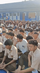 Students in uniform gather outdoors at Tanjungsari school