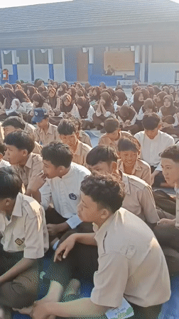 Students in uniform gather outdoors at Tanjungsari school