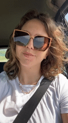Woman drives through Podgorica wearing stylish sunglasses