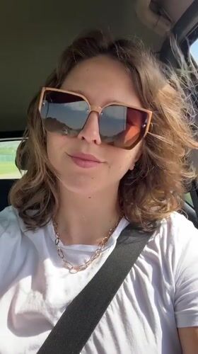Woman drives through Podgorica wearing stylish sunglasses