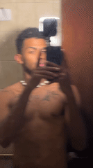 Man takes bathroom mirror selfies in Porlamar, Venezuela