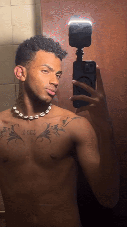Man takes bathroom mirror selfies in Porlamar, Venezuela
