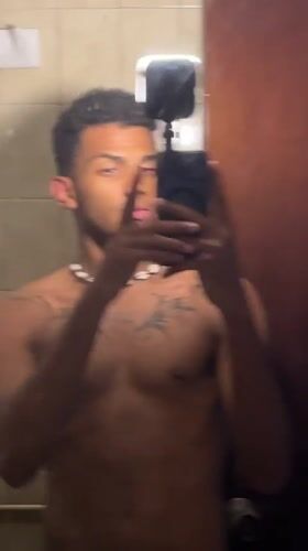 Man takes bathroom mirror selfies in Porlamar, Venezuela