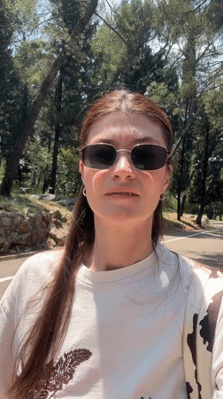Woman enjoys morning walk through blooming Podgorica parkland