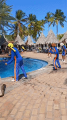 Resort guests capture poolside entertainment and casual moments in Porlamar