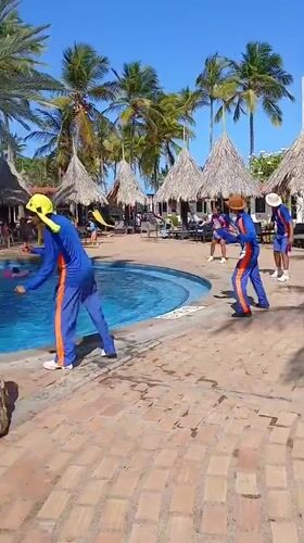 Resort guests capture poolside entertainment and casual moments in Porlamar