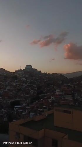 Family playtime and evening scenes documented across Caracas neighborhoods
