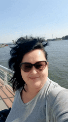 Woman takes riverside selfie in sunny Cairo