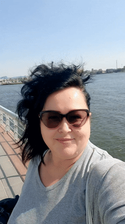 Woman takes riverside selfie in sunny Cairo