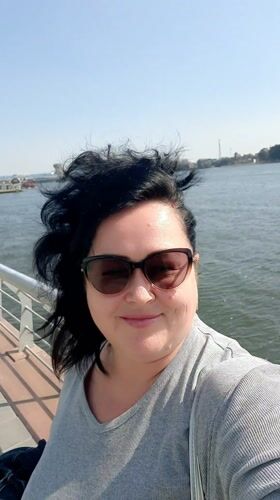 Woman takes riverside selfie in sunny Cairo