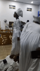 White-robed congregants gather for late-night Celestial Church service