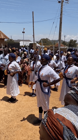Uniformed women with swords perform formation in Bukuru