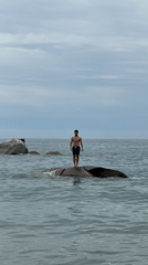 Ocean swimming and rock jumping at Tortolì coastline