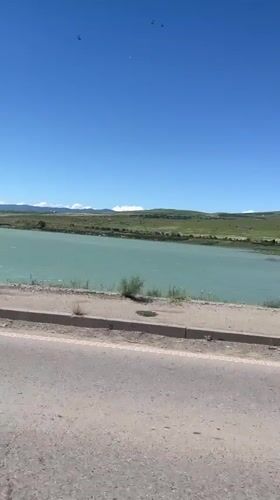 Turquoise river and arched building captured in Tbilisi footage