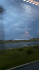 Vehicle passengers record overcast coastal drive near Manavgat, Turkey