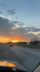 Evening traffic captured on Bulgarian highway during sunset