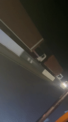 Illuminated truck convoy travels highway near Ado, Nigeria