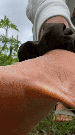Woman visits orange marigold flower field in Kintamani, Indonesia