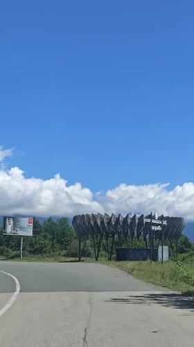Rural drive captured in Inkiti, Abkhazia amid cloudy mountain scenery