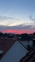 Rooftop barbecue in Viernheim under a vivid summer sunset