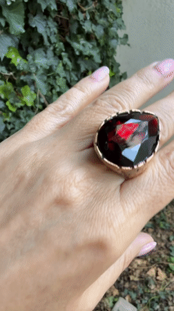 Close-up jewelry showcase in Tashkent — rings, charms, and watches