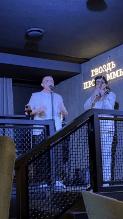 Musical duo performs in white suits at Engels venue