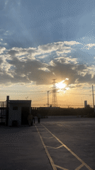Sunset documented behind transmission tower in Buenavista, Mexico