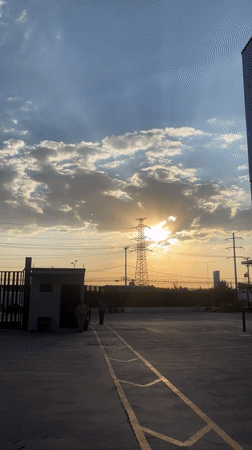 Sunset documented behind transmission tower in Buenavista, Mexico