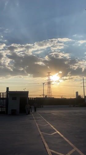 Sunset documented behind transmission tower in Buenavista, Mexico