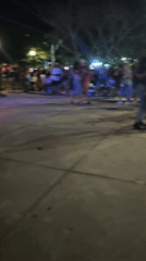 Nighttime outdoor music performance draws dancers in Búzios