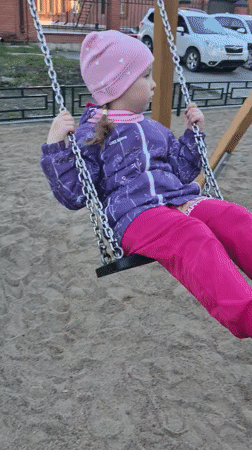 Children play at Tobolsk park playground with swings, scooters