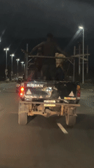 Passengers ride in modified pickup truck bed in Nigeria