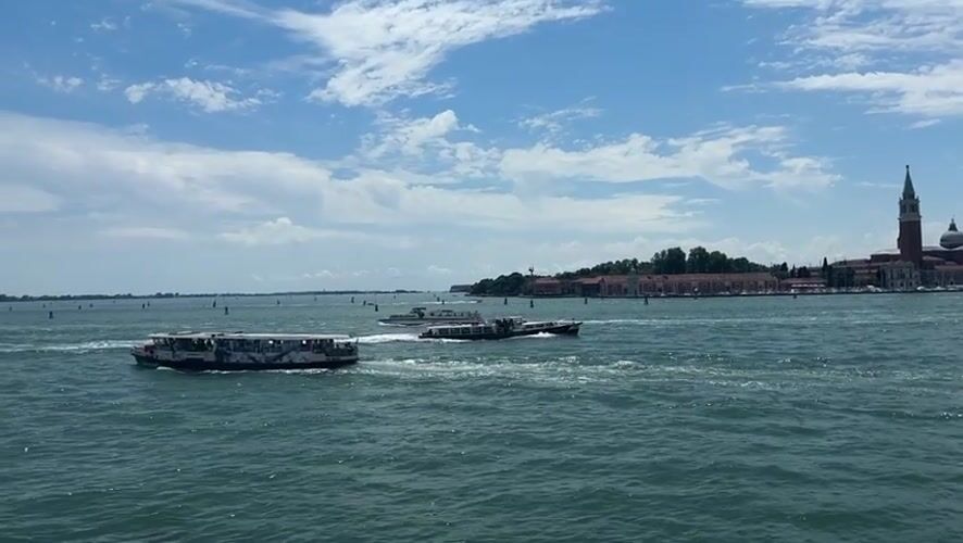 Venice water traffic observed during midday boat transit