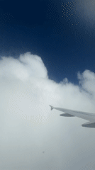 Passenger documents European flight with aerial views, entertainment display