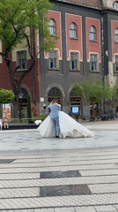 Newlyweds dance in historic Subotica square amid Art Nouveau architecture