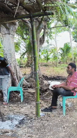 Traditional outdoor celebration with food and ceremony in Merbopuntong